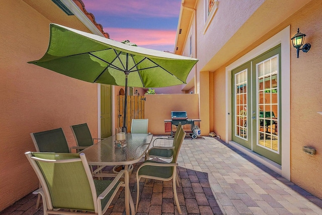 patio terrace at dusk with french doors