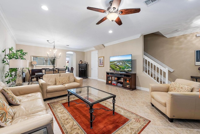 living room with ceiling fan with notable chandelier and crown molding