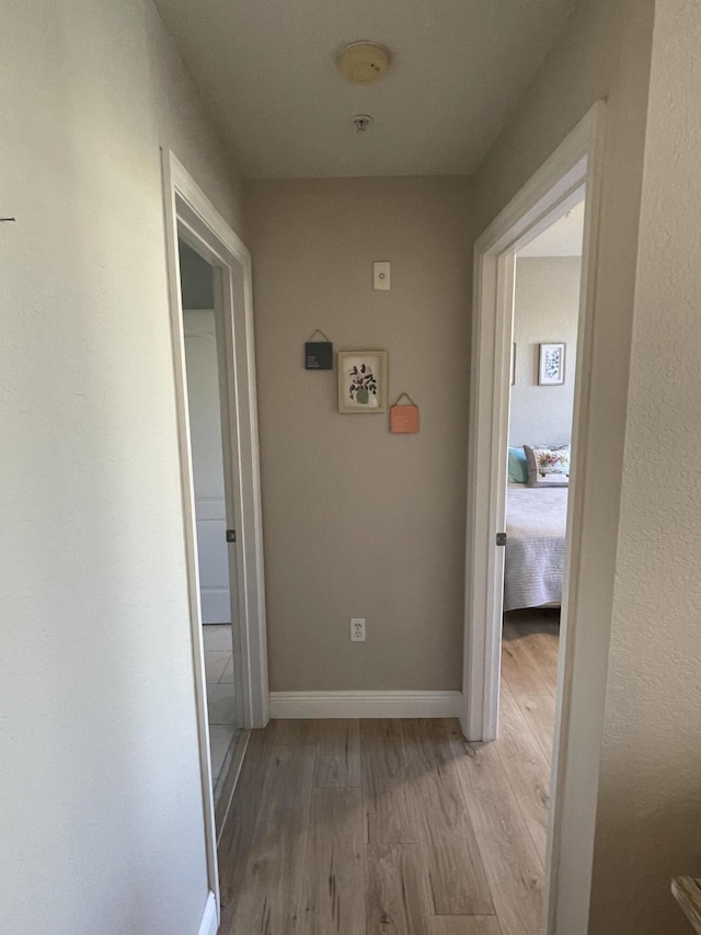 corridor featuring light hardwood / wood-style flooring