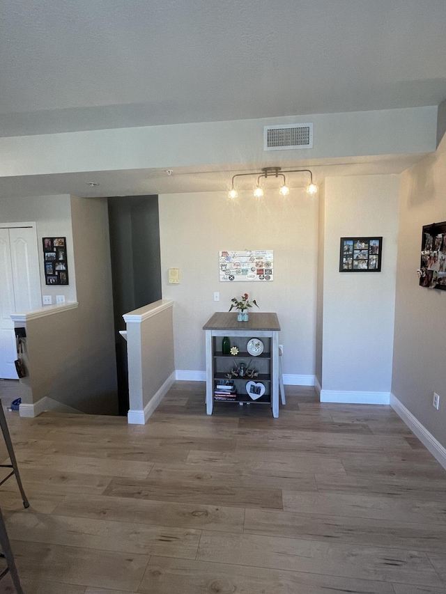 hallway featuring hardwood / wood-style floors