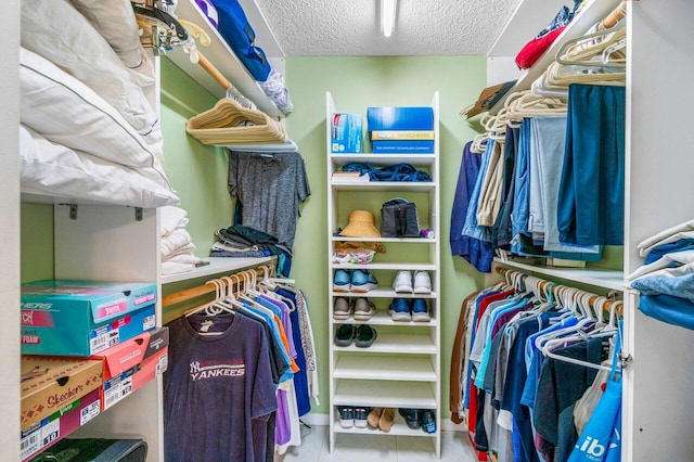 spacious closet featuring light tile patterned flooring