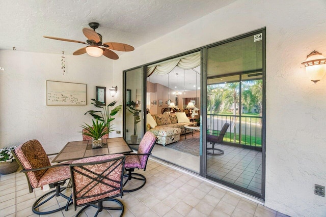 interior space with ceiling fan