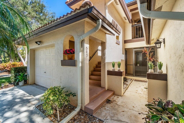 view of exterior entry featuring a garage