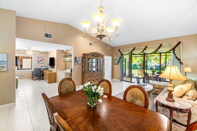 dining area featuring light tile patterned floors, ceiling fan with notable chandelier, and lofted ceiling