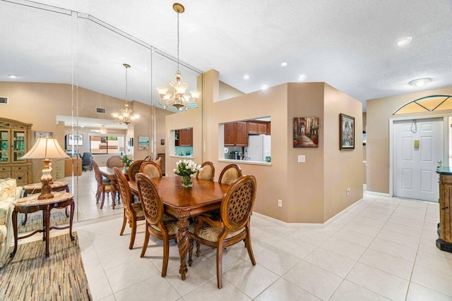 tiled dining room featuring an inviting chandelier, a textured ceiling, and vaulted ceiling