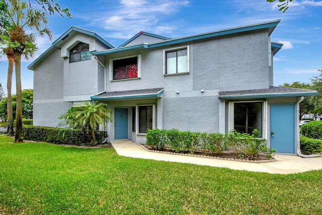 front facade with a front lawn