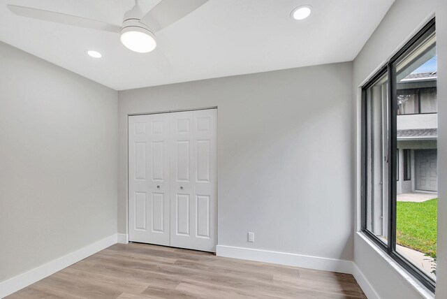 unfurnished bedroom featuring a closet, ceiling fan, and light hardwood / wood-style floors