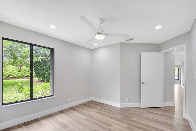 bedroom featuring ceiling fan, light hardwood / wood-style floors, and a closet