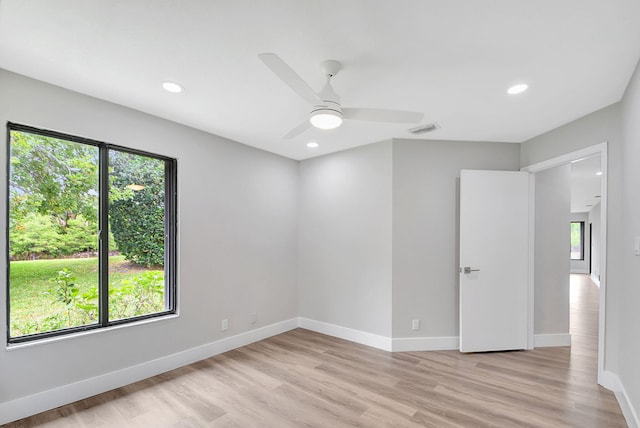 unfurnished room with ceiling fan and light wood-type flooring