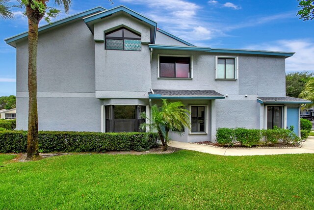 view of property exterior with a lawn