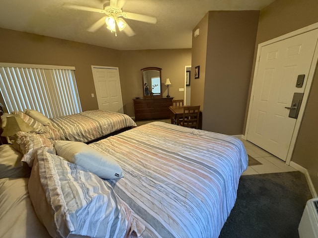 bedroom featuring ceiling fan and light tile patterned flooring