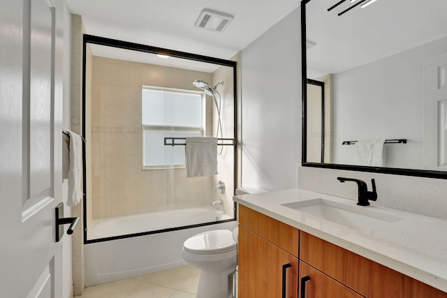 full bathroom featuring tile patterned flooring, vanity, toilet, and enclosed tub / shower combo