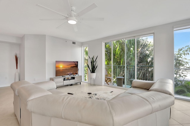 tiled living room with ceiling fan