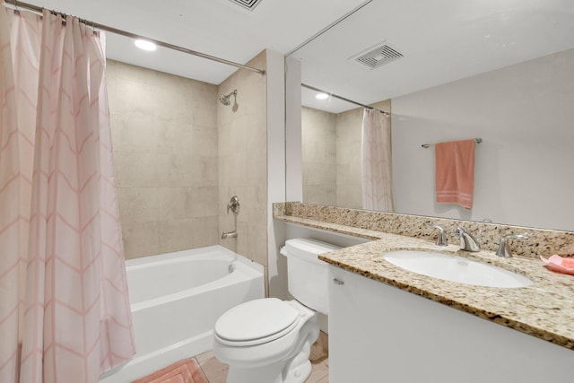 full bathroom with shower / tub combo with curtain, vanity, and toilet