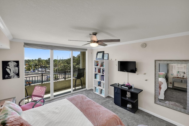 carpeted bedroom with access to outside, ceiling fan, crown molding, and a textured ceiling