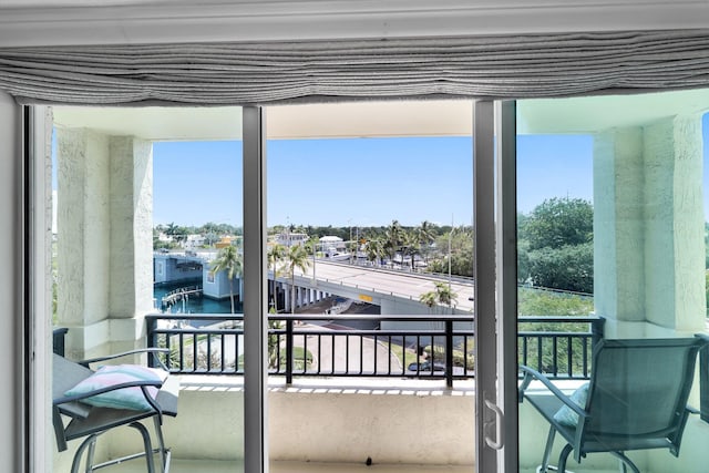 balcony featuring a water view