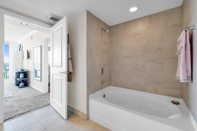 bathroom featuring tile patterned flooring,  shower combination, and crown molding