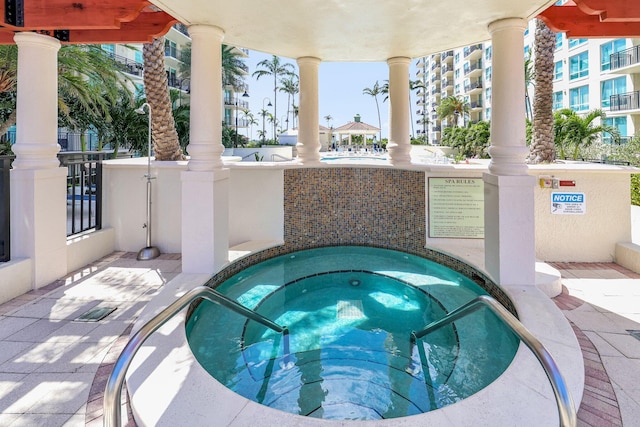 view of pool with a community hot tub