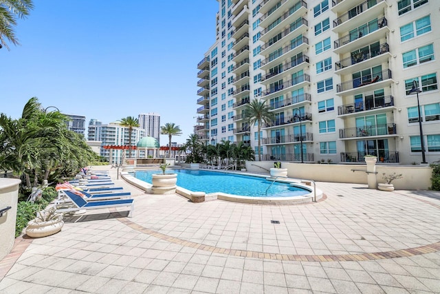 view of swimming pool with a patio area