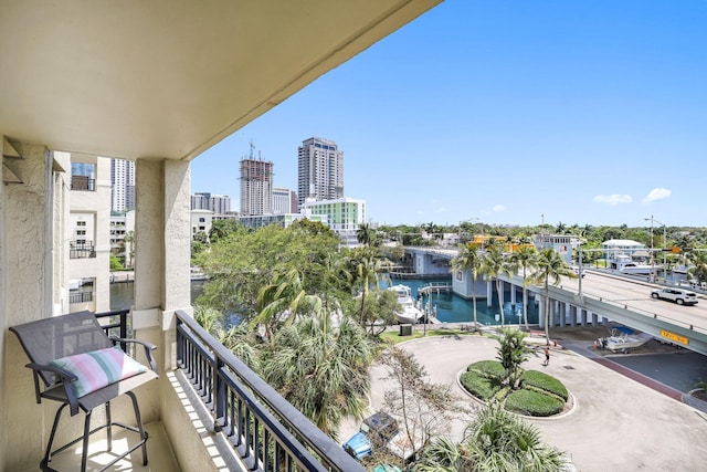 balcony featuring a water view