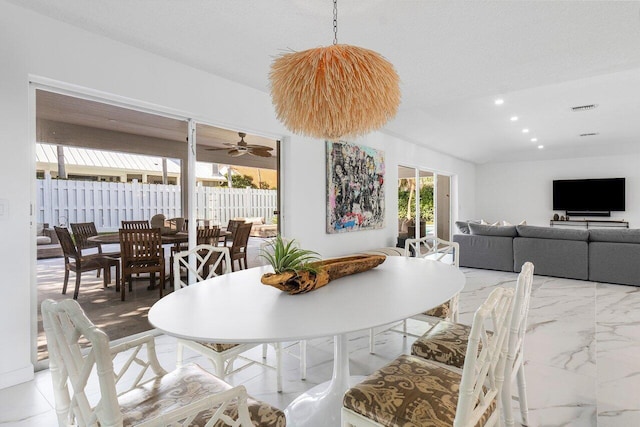 dining area featuring a textured ceiling