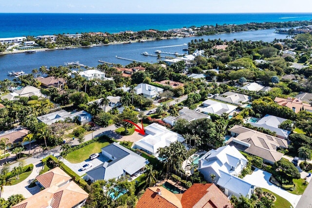 birds eye view of property featuring a water view