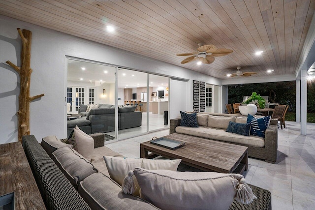 living room with ceiling fan and wood ceiling