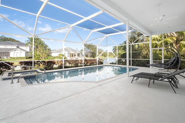 view of pool featuring a patio, ceiling fan, and a lanai