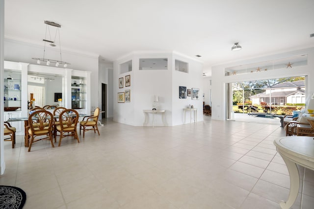 living room featuring ornamental molding and light tile patterned floors