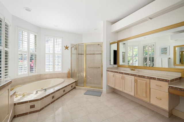 bathroom featuring tile patterned flooring, vanity, and independent shower and bath