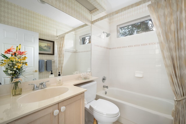 full bathroom with shower / bath combo, toilet, and vanity