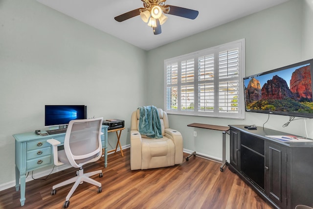 office with dark hardwood / wood-style flooring and ceiling fan