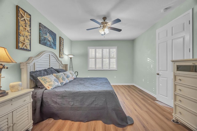 bedroom with ceiling fan and light hardwood / wood-style flooring