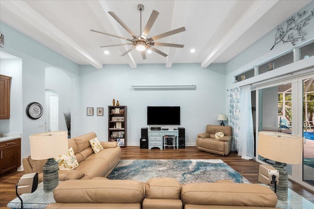 living room featuring ceiling fan, beam ceiling, and dark wood-type flooring