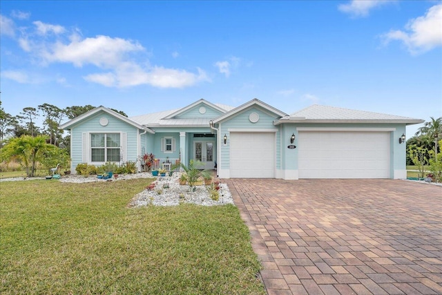 ranch-style home featuring a garage and a front yard