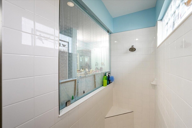 bathroom with tiled shower