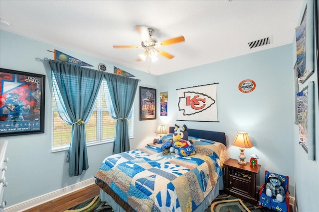 bedroom featuring wood-type flooring and ceiling fan