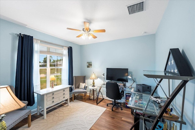 office space featuring hardwood / wood-style flooring and ceiling fan