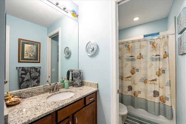 full bathroom with vanity, toilet, and shower / tub combo with curtain