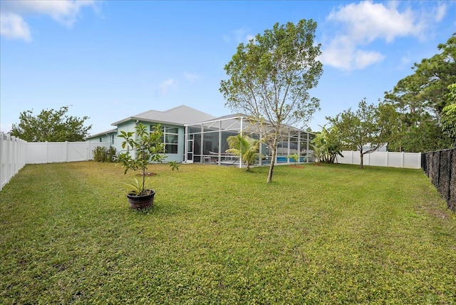 view of yard featuring glass enclosure