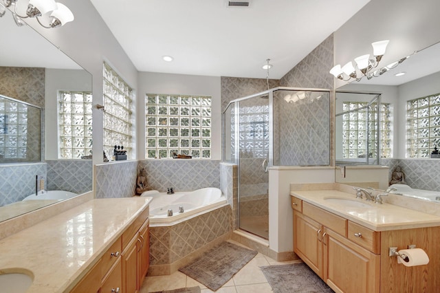 bathroom with vanity, tile patterned flooring, a wealth of natural light, and plus walk in shower