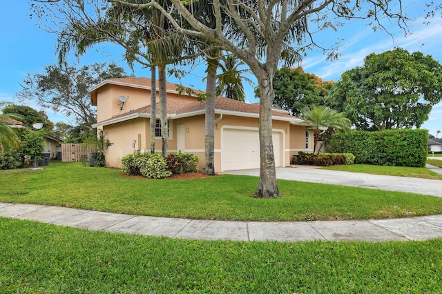 view of front of house with a garage and a front yard