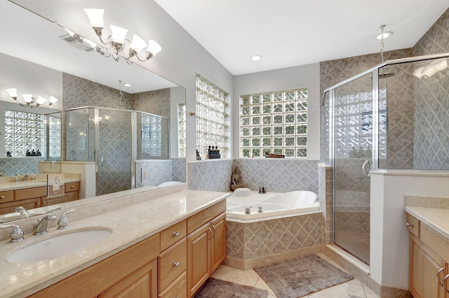 bathroom featuring tile patterned floors, vanity, and separate shower and tub