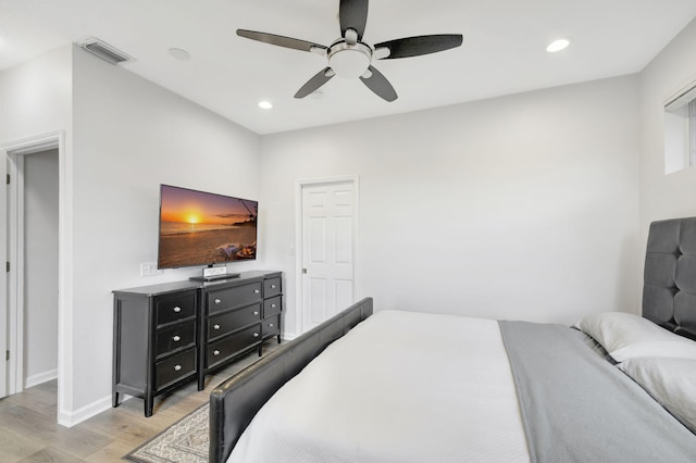 bedroom with ceiling fan and light wood-type flooring