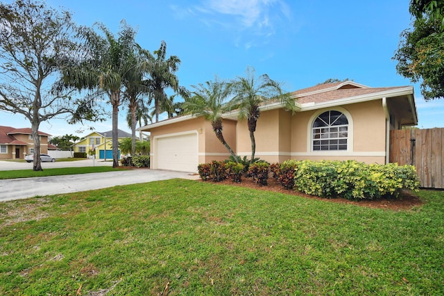 single story home with a front yard and a garage