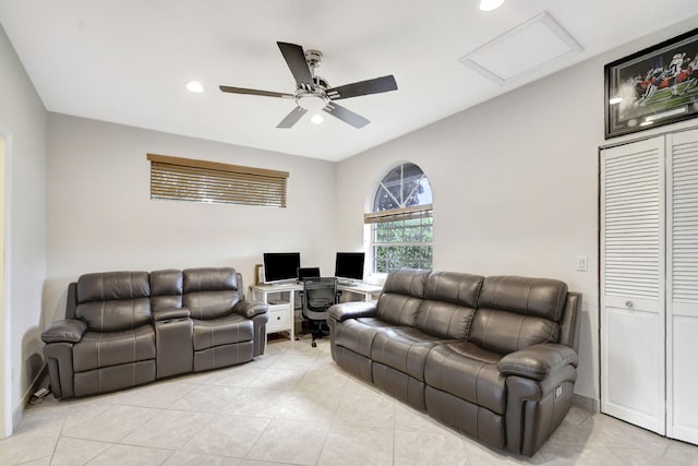 living room with ceiling fan and light tile patterned floors