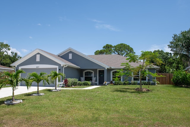 single story home featuring a front yard and a garage