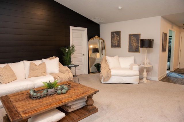 living room with carpet flooring and lofted ceiling