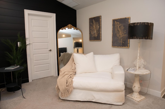 living area with carpet and lofted ceiling