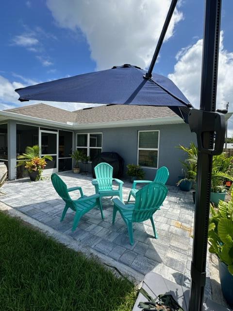 rear view of house with a patio